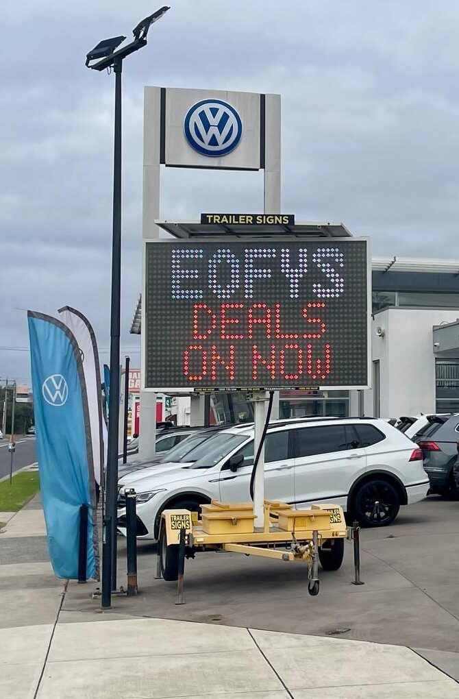 5-colour VMS trailer sign outside Beachside Volkswagen on Dandenong Rd W Frankston advertising “EOFYS Deals on Now”